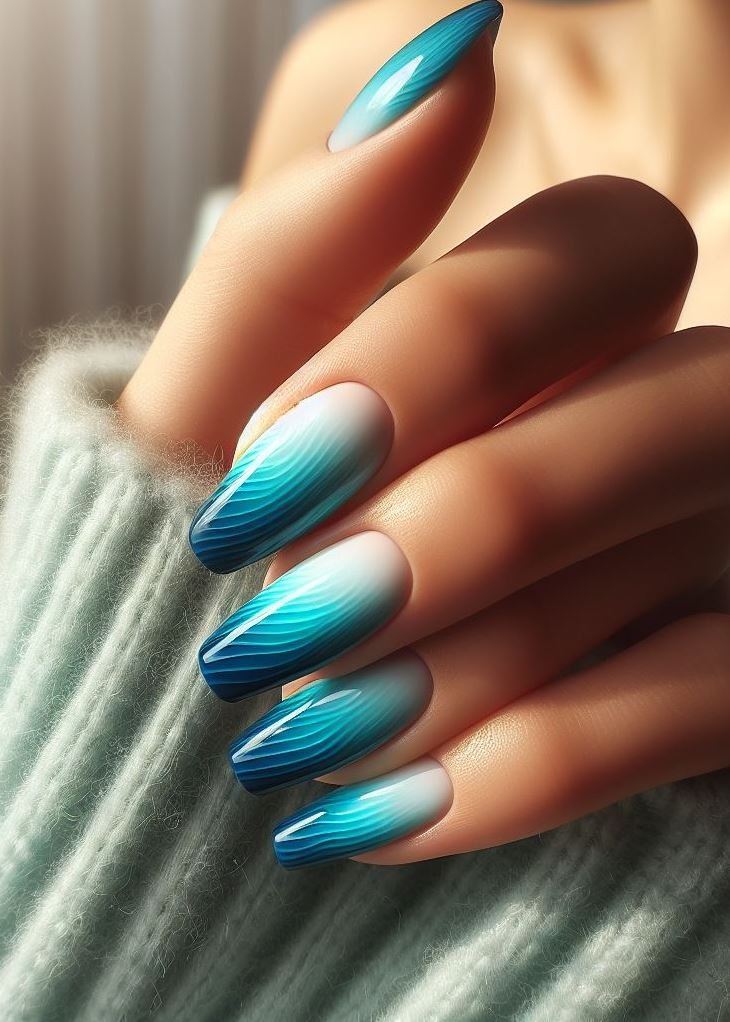 Craving a cool and refreshing mani? Look no further than these calming blue to teal gradient nails.